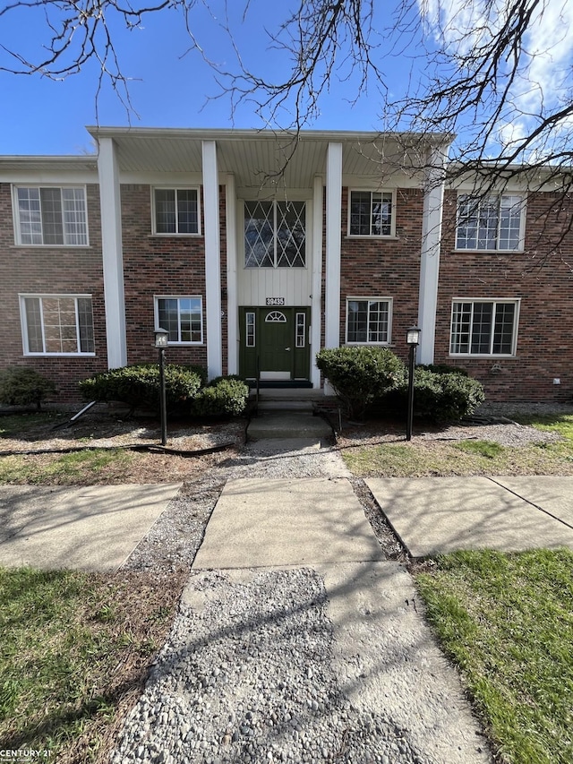 39435 Van Dyke Ave, Sterling Heights, MI 48313 - greek revival house with brick siding