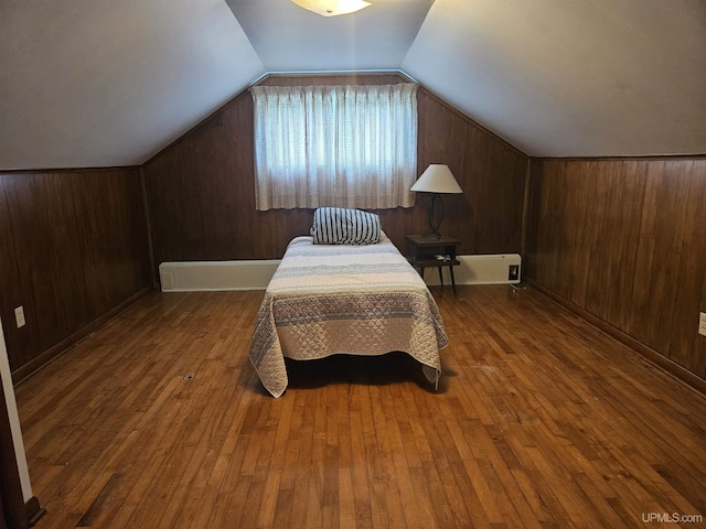 619 N 7th St, Ontonagon, MI 49953 - bedroom featuring hardwood / wood-style floors, vaulted ceiling, and wooden walls
