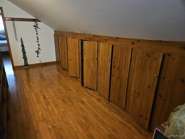 619 N 7th St, Ontonagon, MI 49953 - additional living space featuring light wood-type flooring and vaulted ceiling