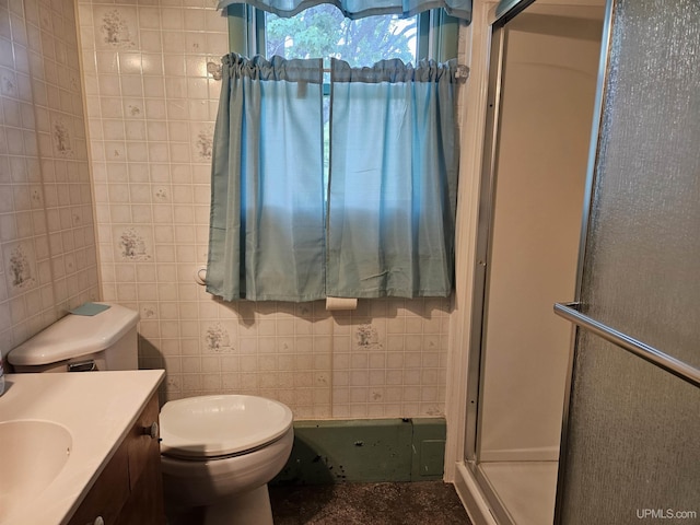 619 N 7th St, Ontonagon, MI 49953 - bathroom featuring vanity, a stall shower, and tile walls
