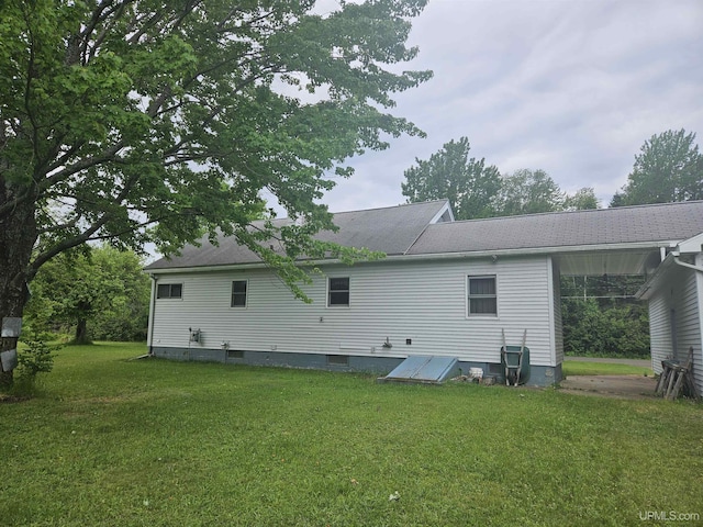 619 N 7th St, Ontonagon, MI 49953 - back of house featuring a yard