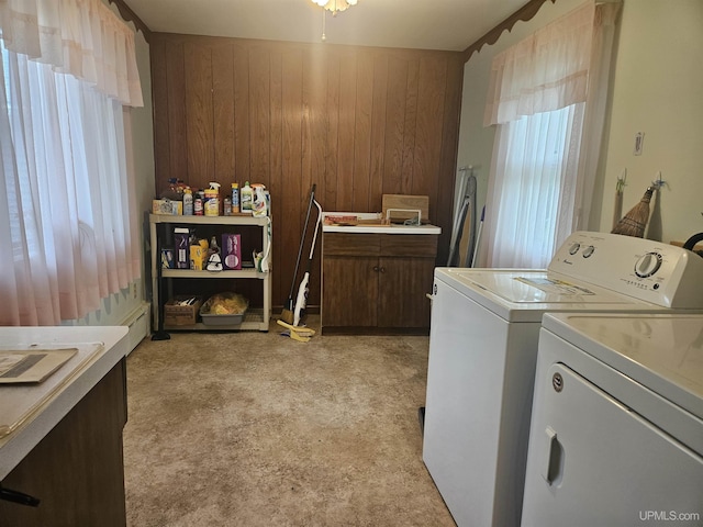 619 N 7th St, Ontonagon, MI 49953 - laundry area with independent washer and dryer, wood walls, and light carpet