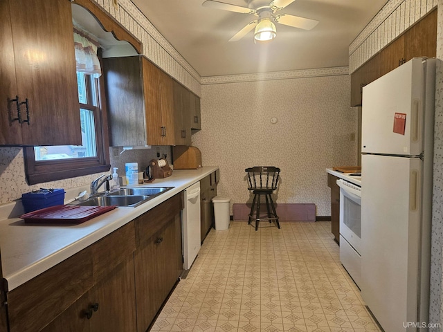 619 N 7th St, Ontonagon, MI 49953 - kitchen with white appliances, wallpapered walls, light countertops, light floors, and ceiling fan