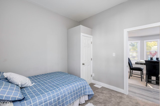 2513 Concord St, Detroit, MI 48207 - bedroom with baseboards and carpet