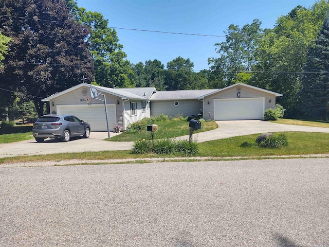 3601 Huckleberry Trl, Farwell, MI 48622 - ranch-style house featuring an attached garage, concrete driveway, and a front yard