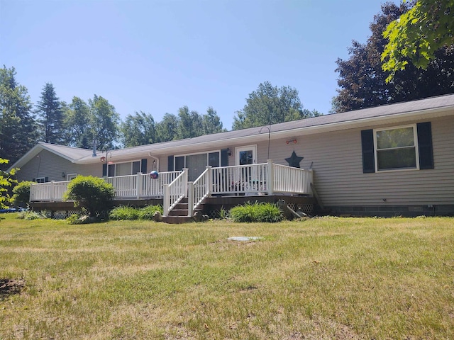 3601 Huckleberry Trl, Farwell, MI 48622 - back of house with crawl space, a deck, and a yard