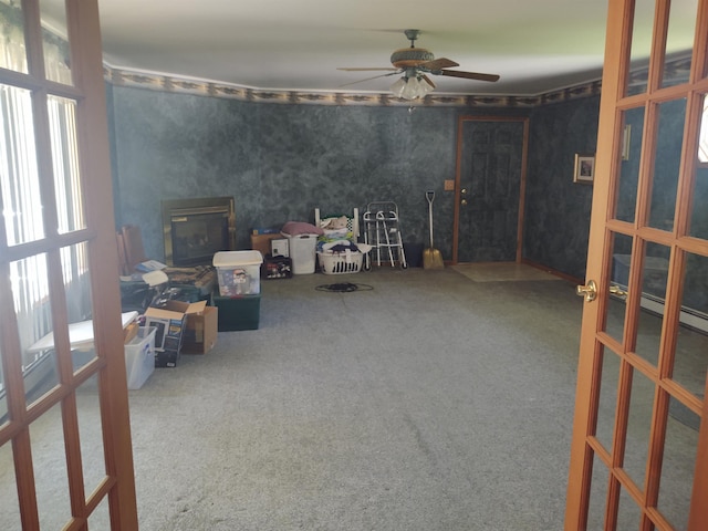 3601 Huckleberry Trl, Farwell, MI 48622 - misc room with carpet flooring, ceiling fan, french doors, a baseboard radiator, and wallpapered walls