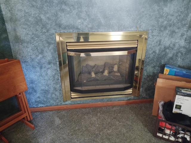 3601 Huckleberry Trl, Farwell, MI 48622 - detailed view of a glass covered fireplace and carpet floors