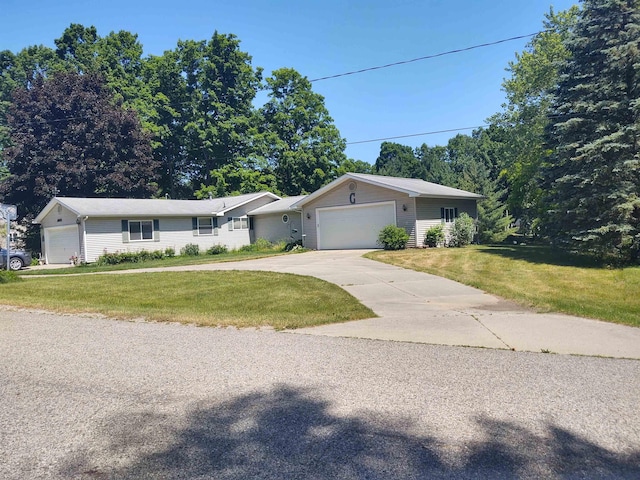 3601 Huckleberry Trl, Farwell, MI 48622 - ranch-style home with a front yard, a garage, and driveway