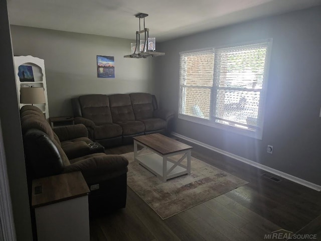 7283 S Fork Dr, Swan Creek, MI 48473 - living room with dark wood-style floors and baseboards
