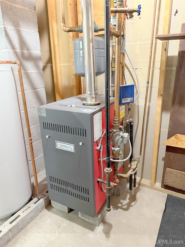 21805 Number 9 Rd, Hancock, MI 49930 - utility room with water heater and a heating unit