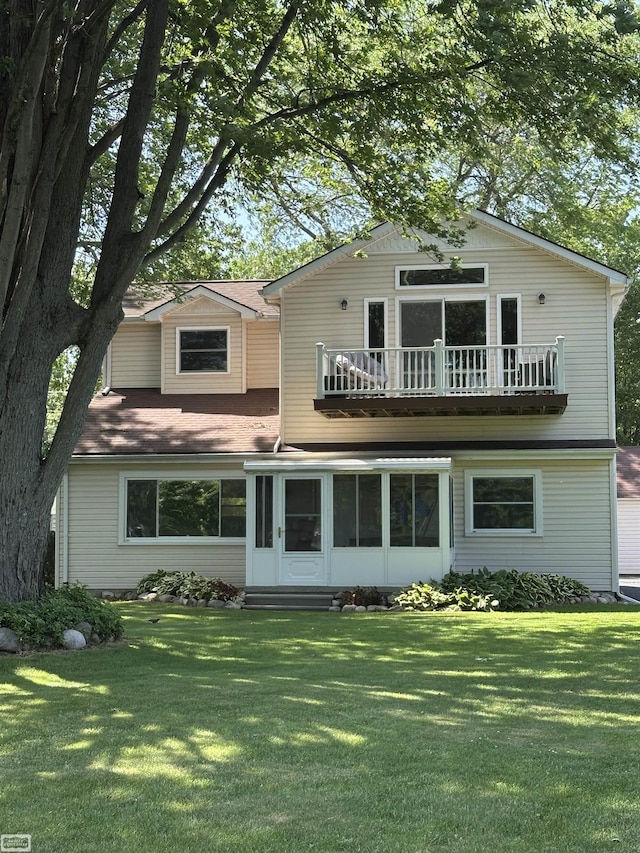 2100 Michigan St, Algonac, MI 48001 - traditional home with a balcony, a front lawn, and a sunroom