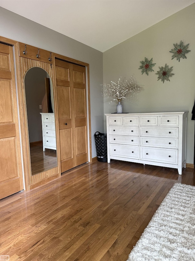2100 Michigan St, Algonac, MI 48001 - bedroom featuring dark wood-style floors and arched walkways