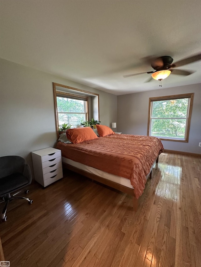 2100 Michigan St, Algonac, MI 48001 - bedroom featuring wood-type flooring, multiple windows, and ceiling fan