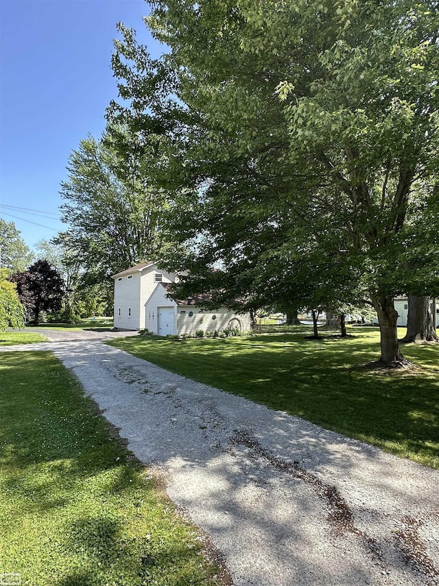 2100 Michigan St, Algonac, MI 48001 - view of grassy yard featuring driveway