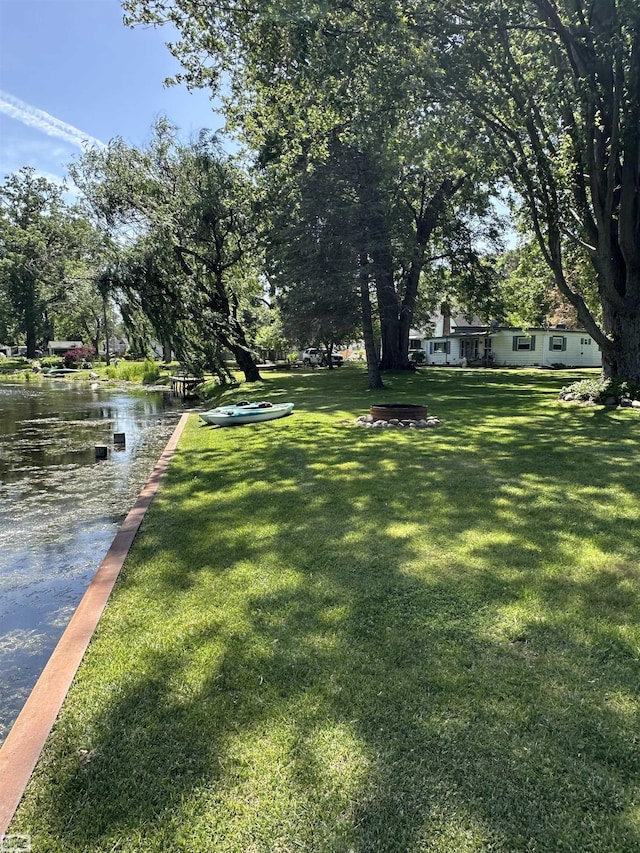 2100 Michigan St, Algonac, MI 48001 - view of grassy yard with a water view and a boat dock