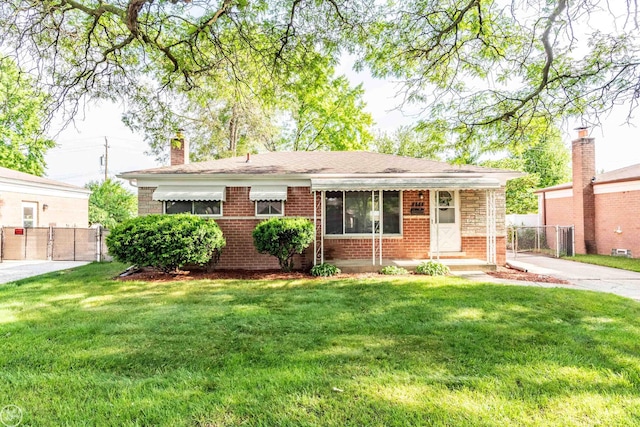 4444 Martin Rd, Warren, MI 48092 - view of front of home featuring brick siding, a gate, and a chimney