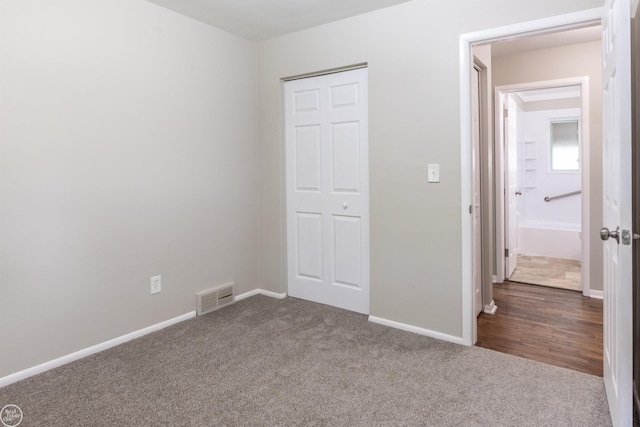 4444 Martin Rd, Warren, MI 48092 - unfurnished bedroom with dark colored carpet and baseboards