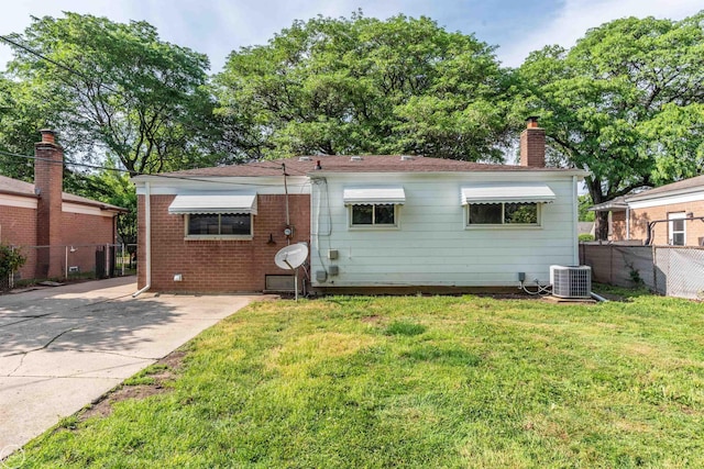 4444 Martin Rd, Warren, MI 48092 - rear view of property with a chimney, brick siding, and driveway