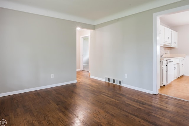 4444 Martin Rd, Warren, MI 48092 - empty room with a sink and wood finished floors