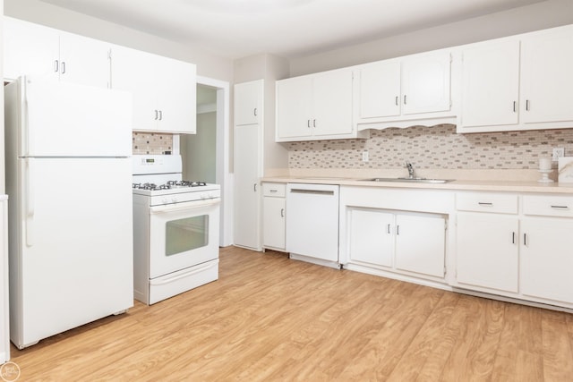 4444 Martin Rd, Warren, MI 48092 - kitchen featuring white appliances, light countertops, backsplash, and light wood-style floors