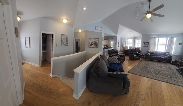 11639 State Rd, Nunica, MI 49448 - living area with lofted ceiling, hardwood / wood-style flooring, and a ceiling fan