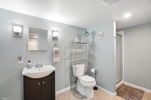 31222 Settlers Way Dr, Flat Rock, MI 48134 - full bath featuring wood finished floors, vanity, and a shower with shower door