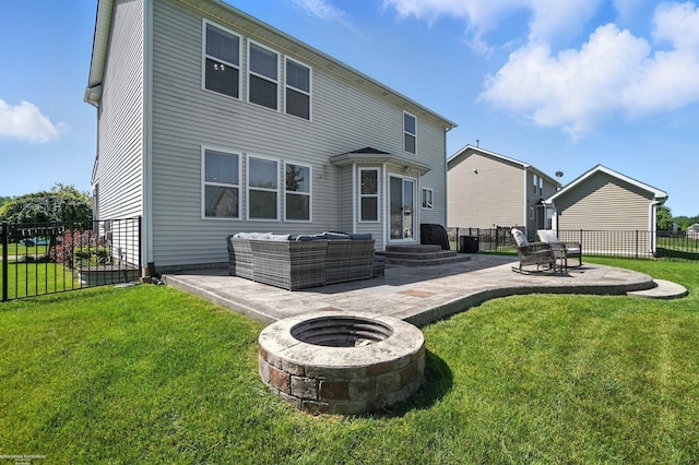 31222 Settlers Way Dr, Flat Rock, MI 48134 - rear view of house with a patio area and an outdoor living space with a fire pit
