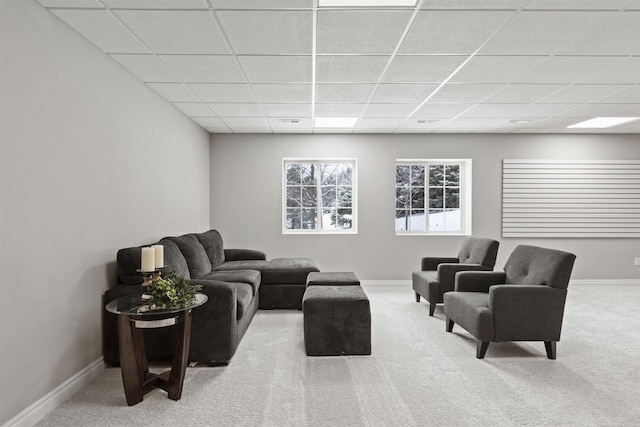 2233 Chase Dr Unit 105, Howell, MI 48855 - carpeted living area featuring a drop ceiling and baseboards