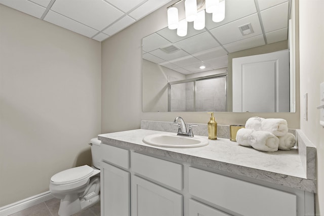 2233 Chase Dr Unit 105, Howell, MI 48855 - bathroom featuring a paneled ceiling, tiled shower, vanity, and tile patterned floors