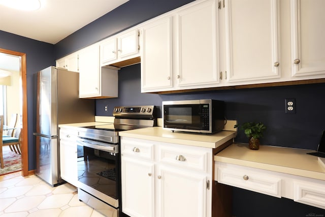 129 Cherryl Ln, Algonac, MI 48001 - kitchen with appliances with stainless steel finishes, light countertops, white cabinets, and light flooring