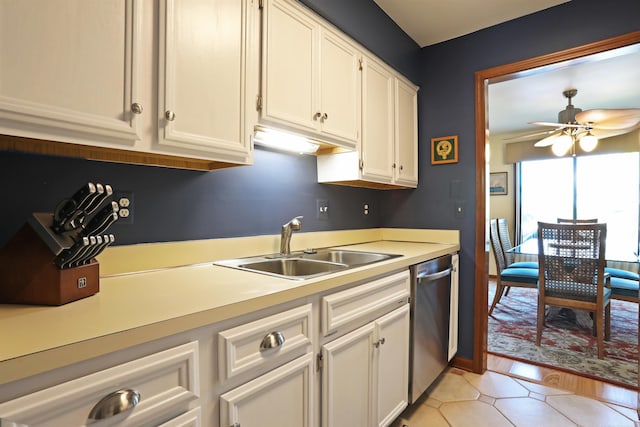 129 Cherryl Ln, Algonac, MI 48001 - kitchen featuring stainless steel dishwasher, light countertops, white cabinetry, and a ceiling fan