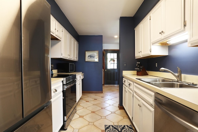 129 Cherryl Ln, Algonac, MI 48001 - kitchen featuring appliances with stainless steel finishes, light countertops, white cabinets, and recessed lighting
