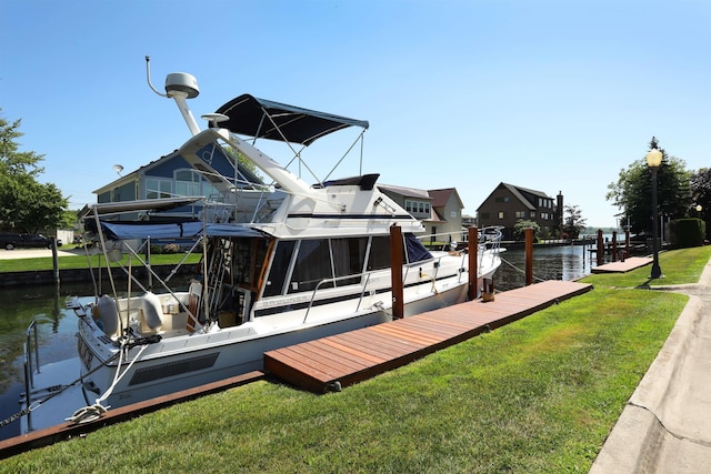 129 Cherryl Ln, Algonac, MI 48001 - dock area featuring a lawn and a water view