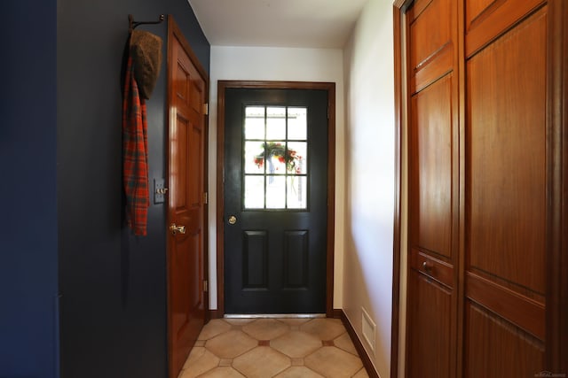 129 Cherryl Ln, Algonac, MI 48001 - doorway to outside featuring baseboards