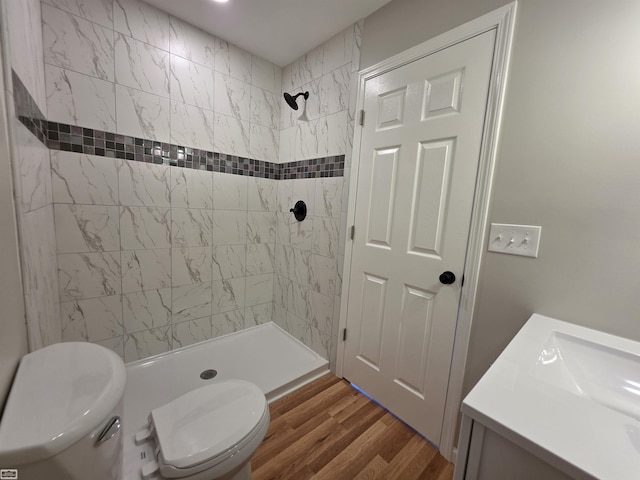 1329 Vermont Rd, Marysville, MI 48040 - bathroom with tiled shower, vanity, and wood finished floors