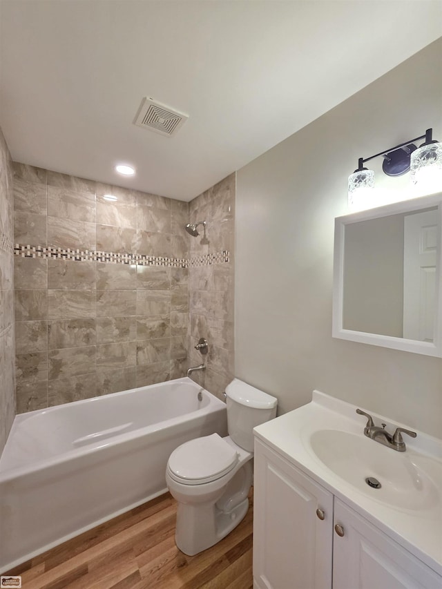 1329 Vermont Rd, Marysville, MI 48040 - full bathroom featuring wood finished floors, vanity, and shower / washtub combination