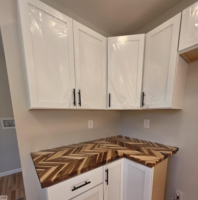 1329 Vermont Rd, Marysville, MI 48040 - kitchen featuring wood counters, white cabinetry, and wood finished floors