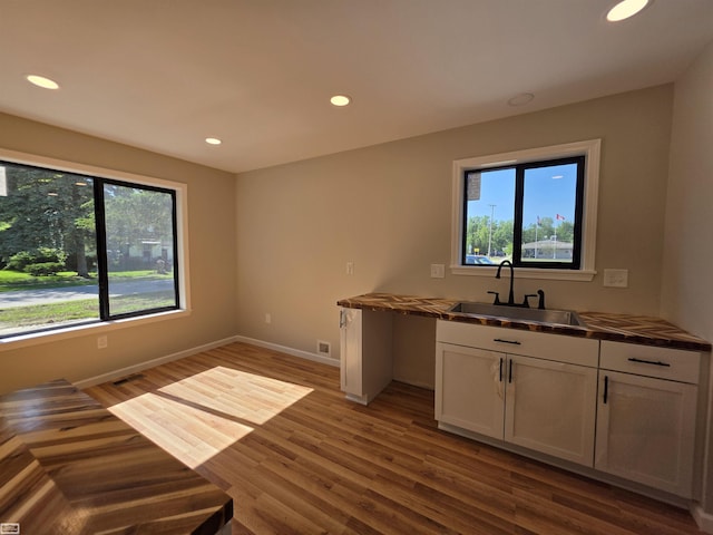 1329 Vermont Rd, Marysville, MI 48040 - kitchen with wood finished floors, recessed lighting, and white cabinetry