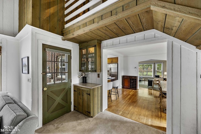 1344 Torrey Rd, Grosse Pointe Woods, MI 48236 - bar with stainless steel fridge, light colored carpet, and wood ceiling