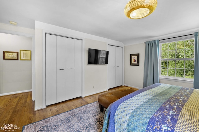 1344 Torrey Rd, Grosse Pointe Woods, MI 48236 - bedroom featuring multiple closets and wood finished floors