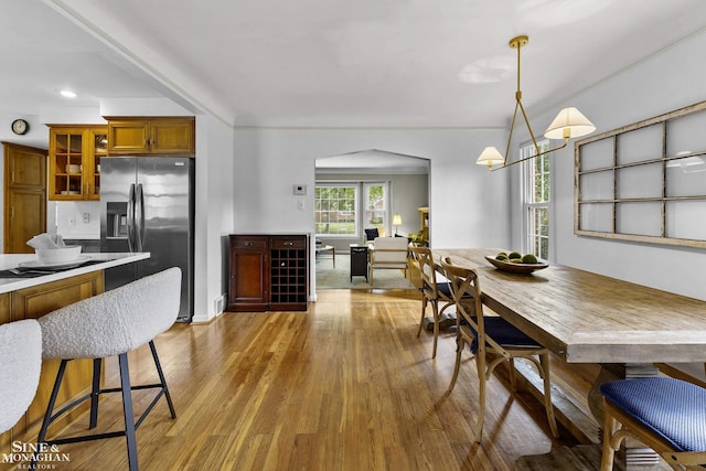 1344 Torrey Rd, Grosse Pointe Woods, MI 48236 - dining space featuring wood finished floors, arched walkways, and recessed lighting