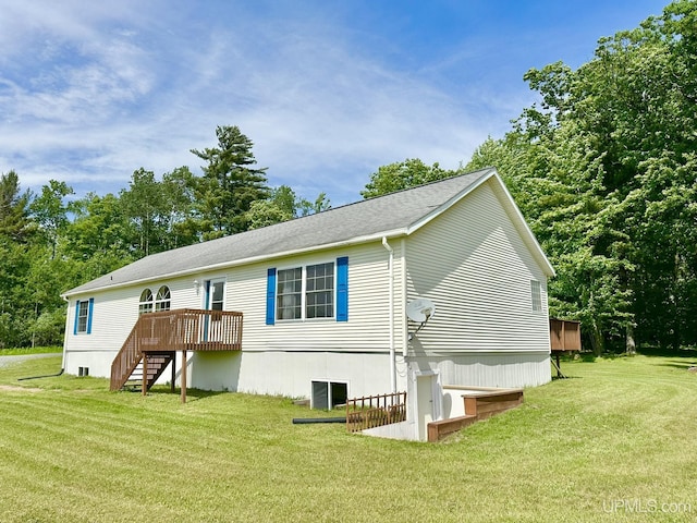 3901 Garretts Ln, Florence T-Wi, WI 54121 - back of property with stairway, a wooden deck, a lawn, and roof with shingles