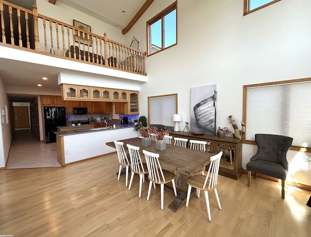 10125 Saint John Dr, Algonac, MI 48001 - dining area with a high ceiling and light wood-style floors