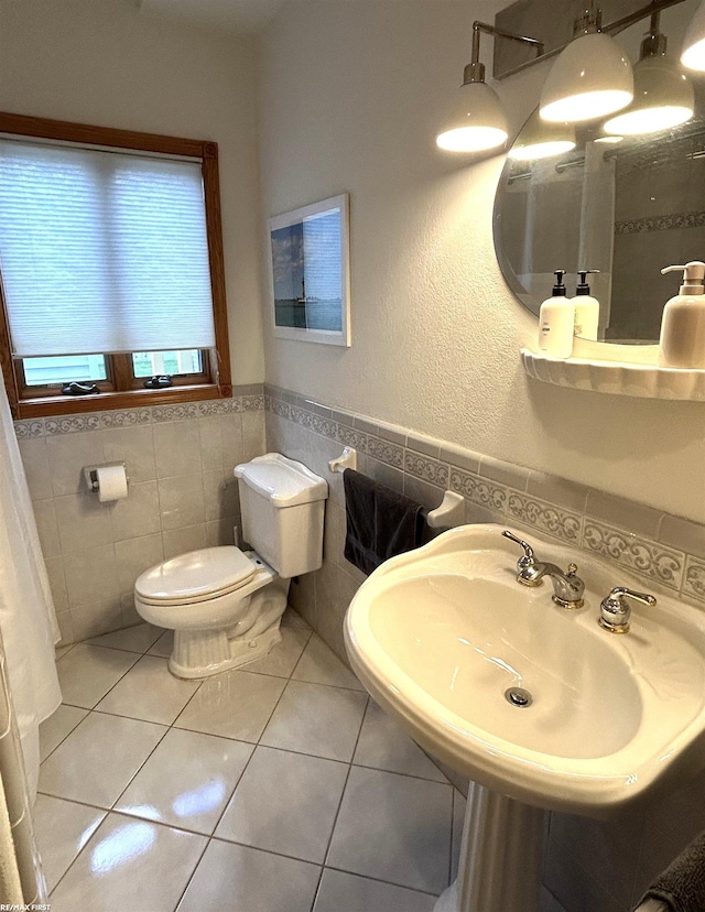 10125 Saint John Dr, Algonac, MI 48001 - bathroom featuring tile walls, tile patterned floors, and a wainscoted wall