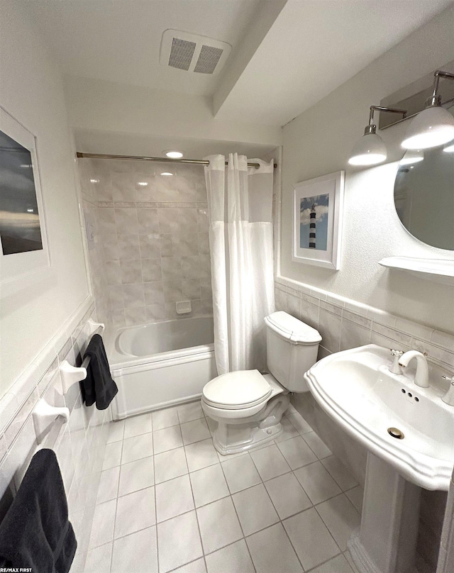 10125 Saint John Dr, Algonac, MI 48001 - full bathroom with tile patterned floors, shower / tub combo with curtain, and a wainscoted wall