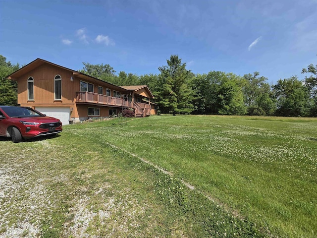 55305 Fairchild Rd, Macomb, MI 48042 - view of green lawn with a wooden deck and a garage