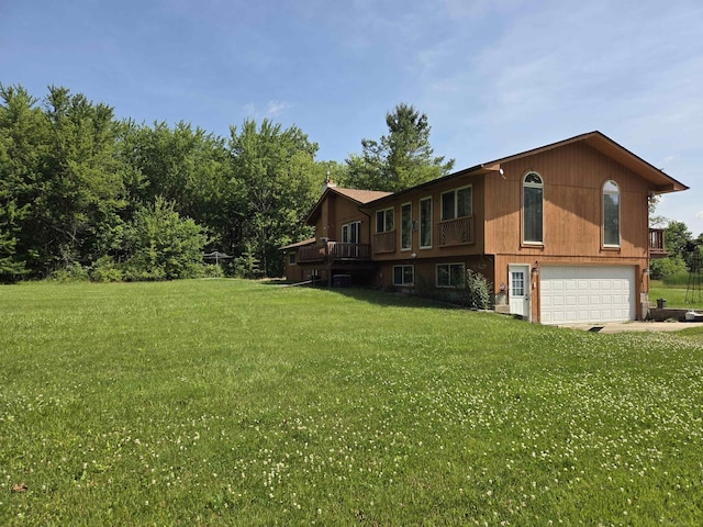 55305 Fairchild Rd, Macomb, MI 48042 - view of property exterior featuring an attached garage, a yard, driveway, and a wooden deck