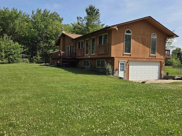 55305 Fairchild Rd, Macomb, MI 48042 - view of front of home with an attached garage, a front lawn, a deck, and concrete driveway