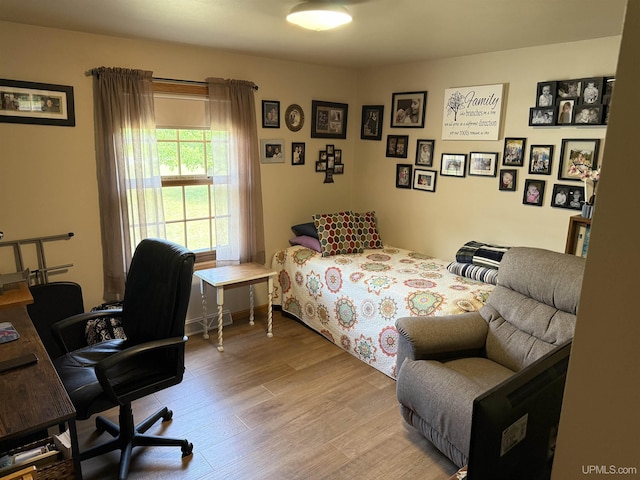 N7722 Candy Cane Rd, Munising, MI 49862 - bedroom with light wood finished floors and a desk